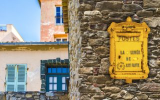 How does the French post office help local communities in France?
