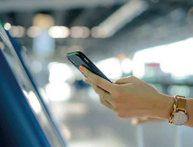 A person scanning a screen with their phone